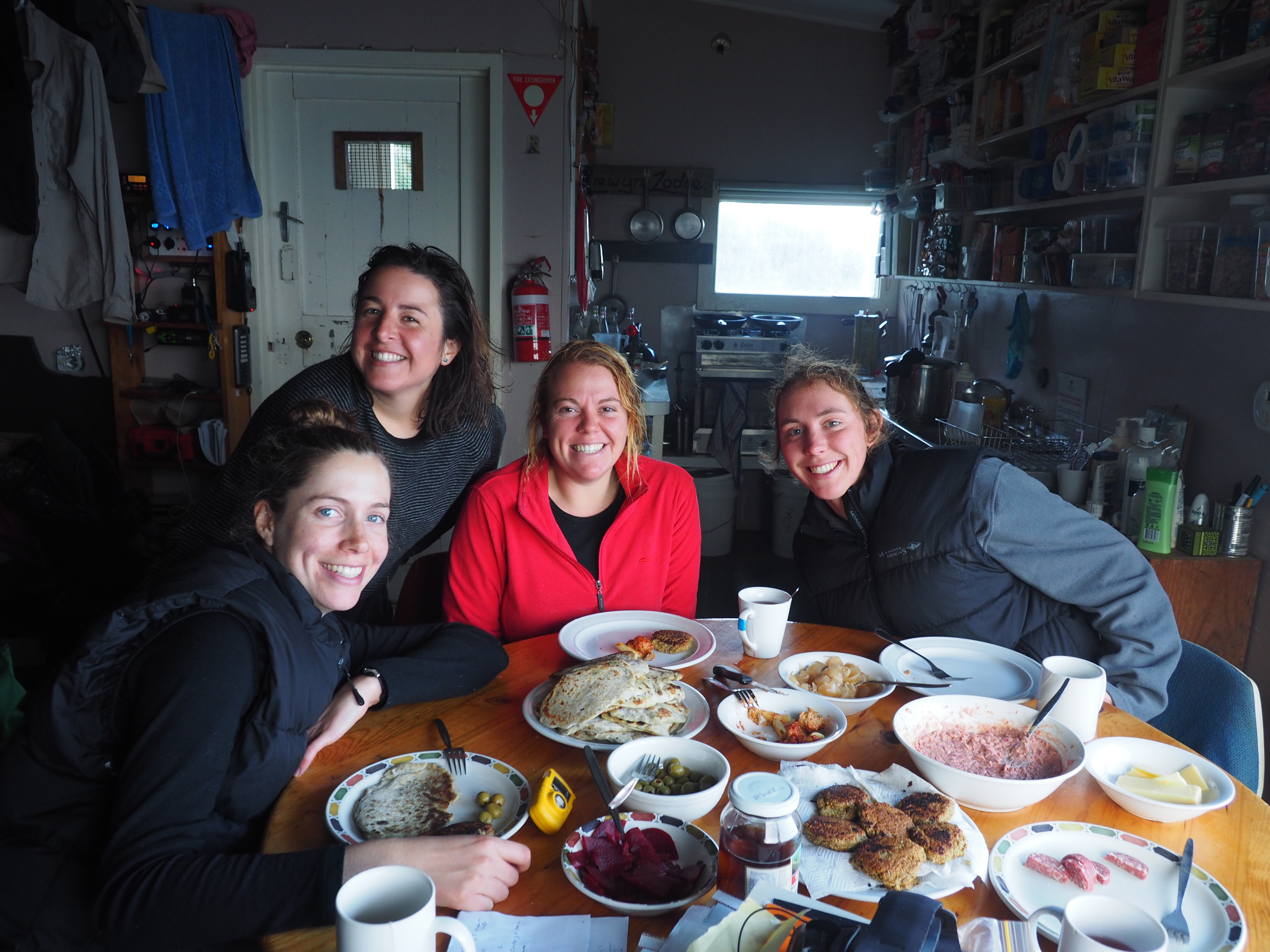 Emily Andrea Mel And Penny Enjoying A Feast In Hurd Point Hut After A Successful Day In The Field Photo By Andrea Turbett